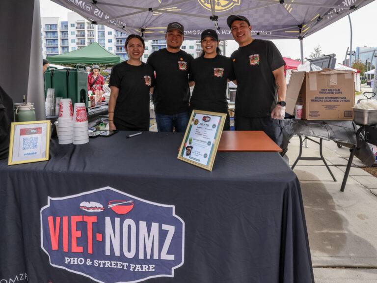 The team from Viet Nomz behind their food booth at Celebrate Lunar