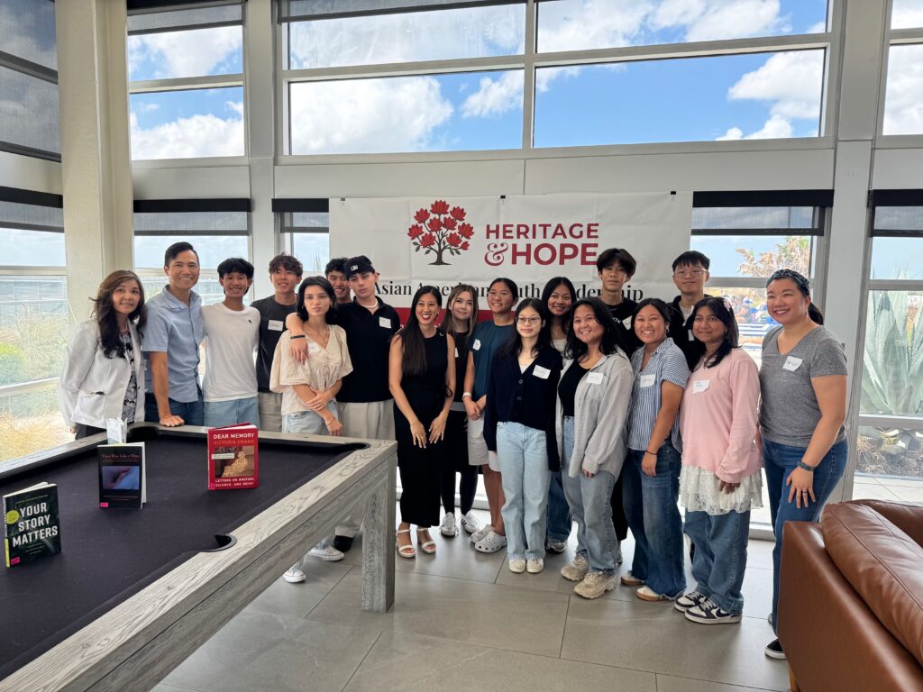 Students and mentors gathered under the Heritage and Hope banner at the Launch Day Celebration workshop in Downtown Orlando