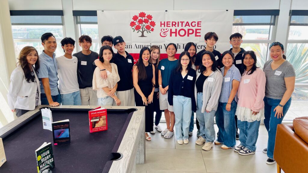 Students and mentors gathered for a group photo under the Heritage and Hope banner